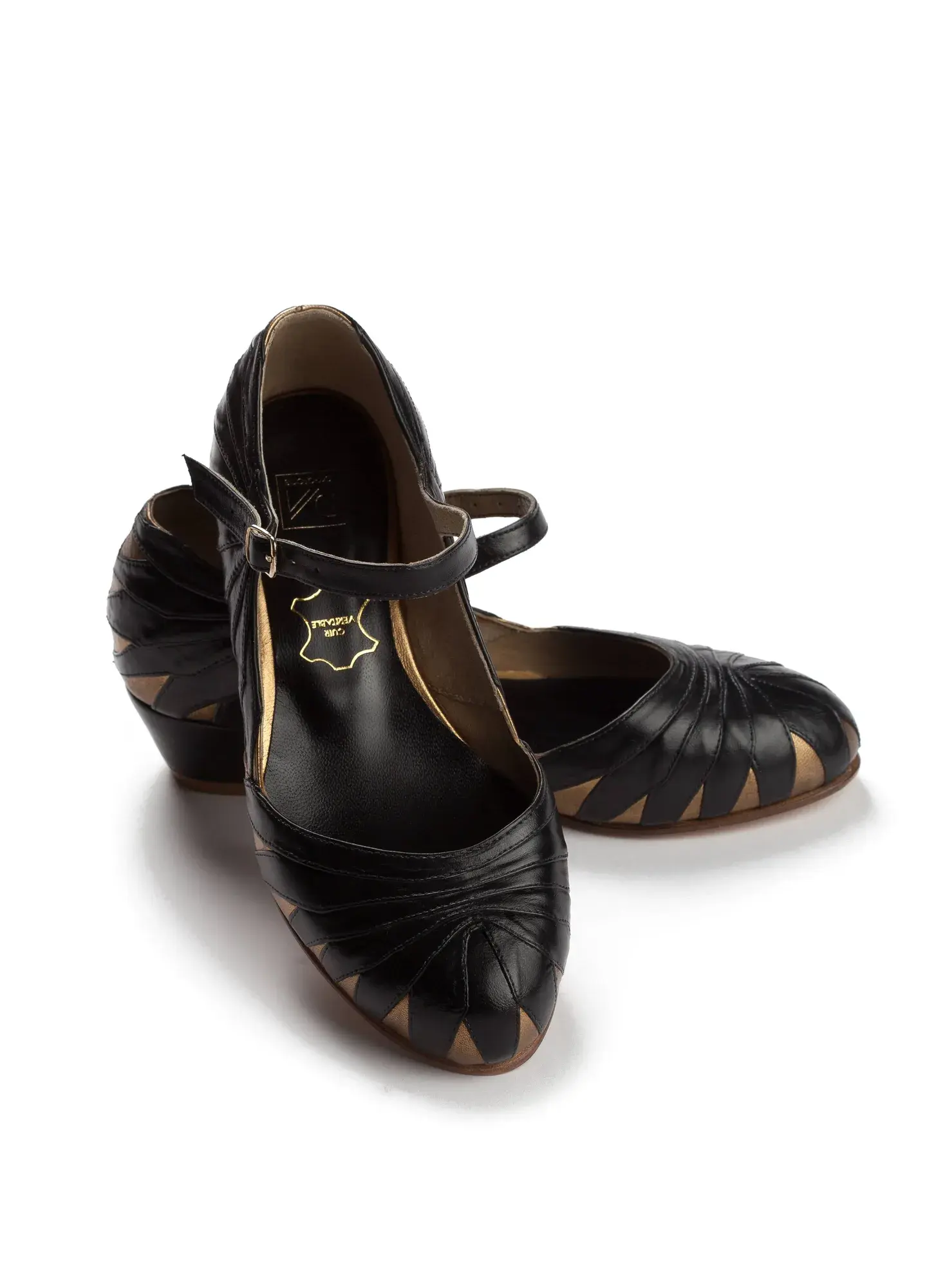 Black and Gold Mary Janes, seen from the front at an angle