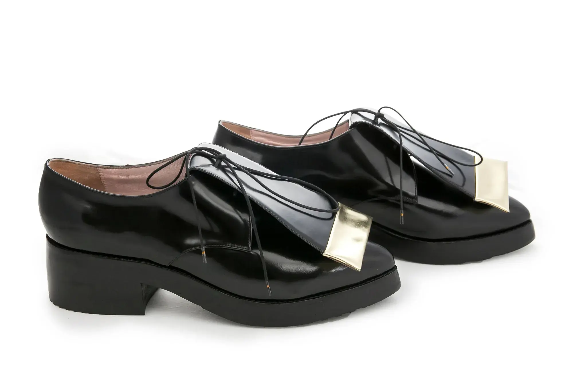 Black Patent Derbies, seen from the front at an angle