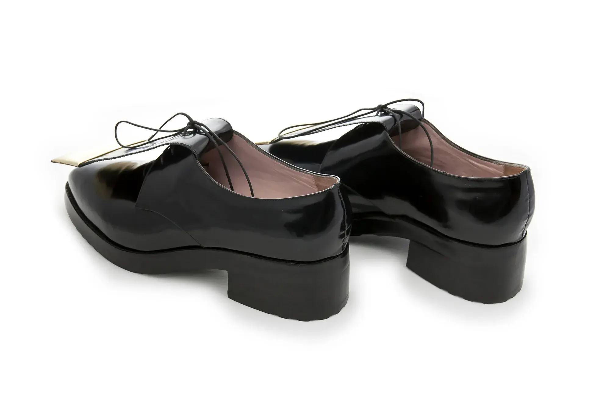 Black Patent Derbies, seen from behind