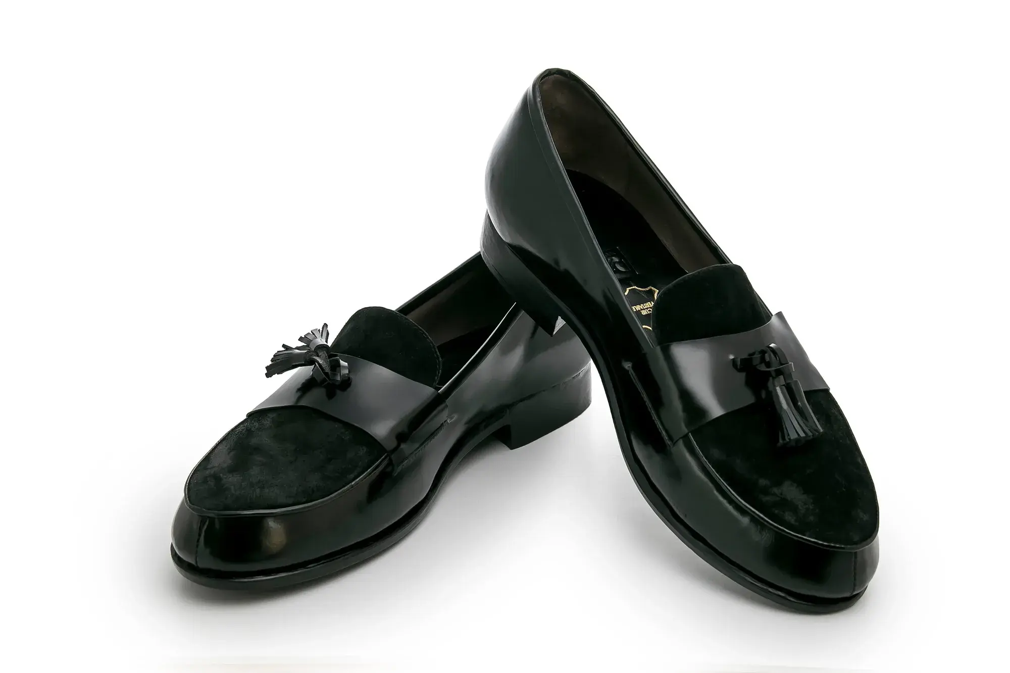 Black Tassel Loafers, seen from the front at an angle