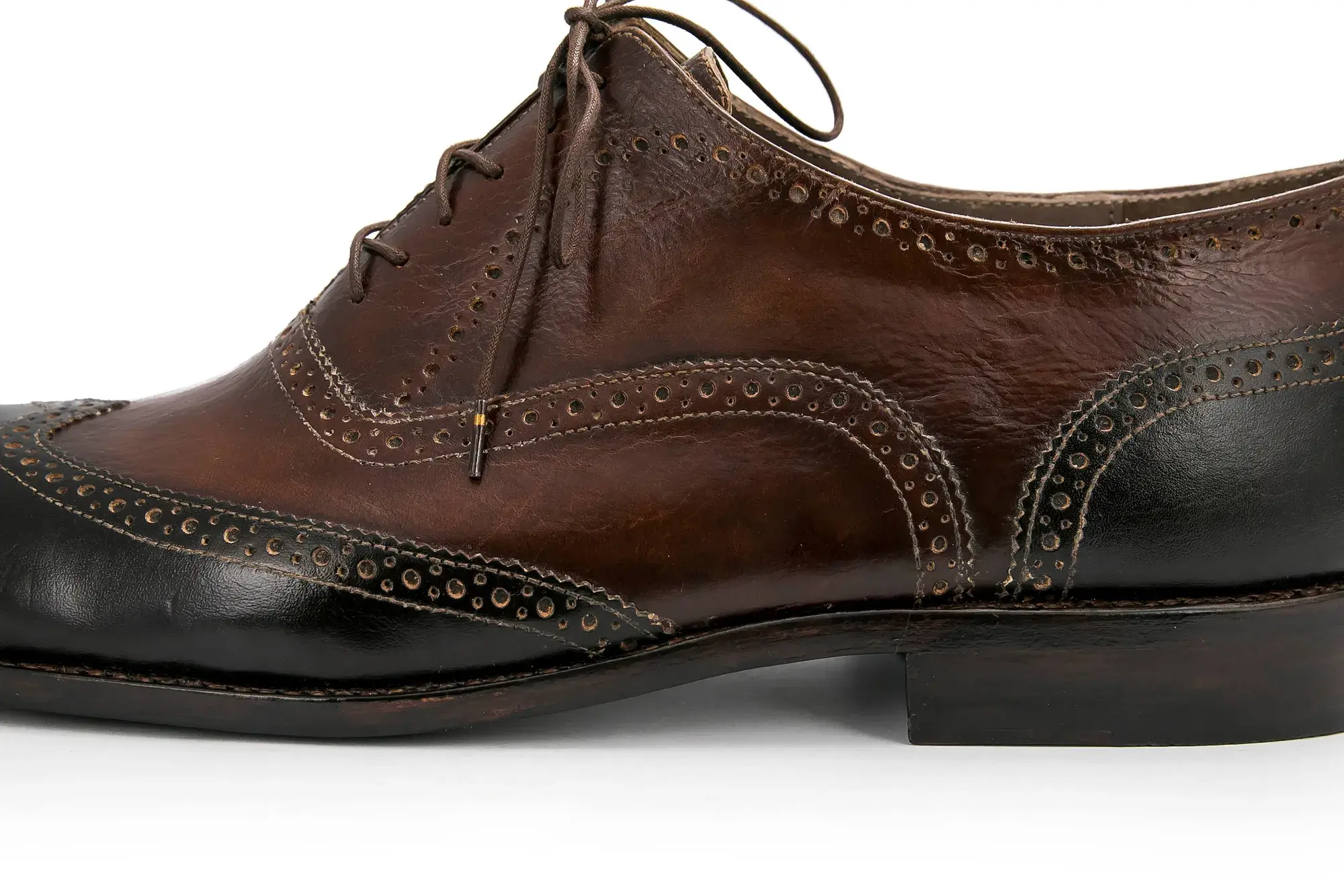 A brown and black brogue seen from the side