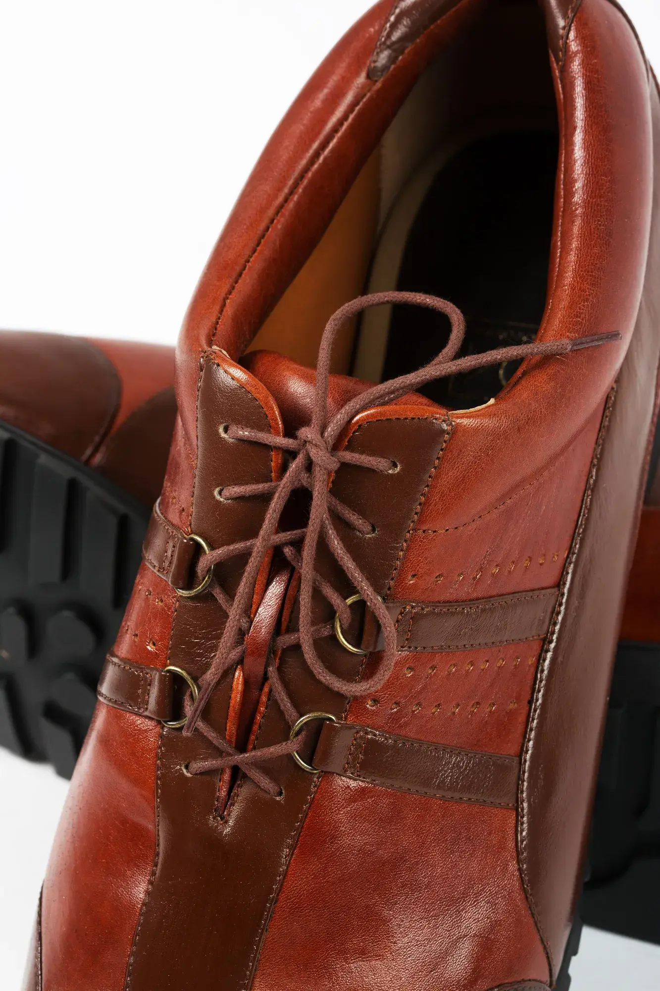 Lacing detail of a chestnut lace-up