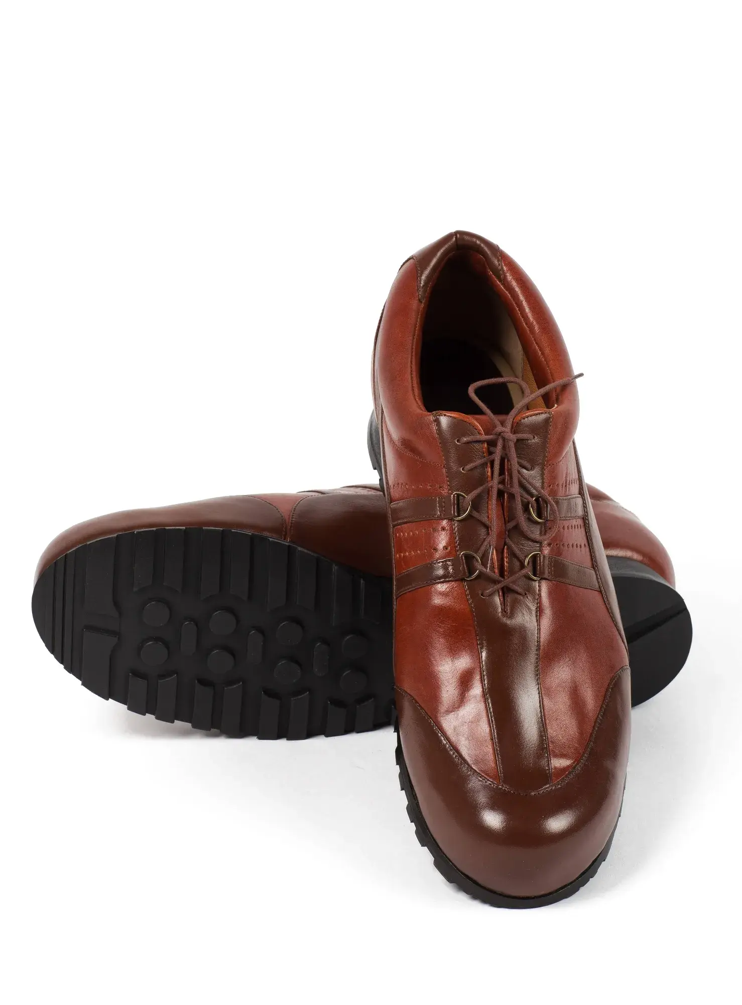 Chestnut Lace-ups, one resting across the other