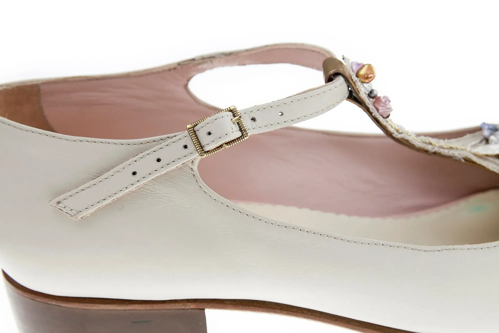 Strap detail of an ivory jewelled T-bar