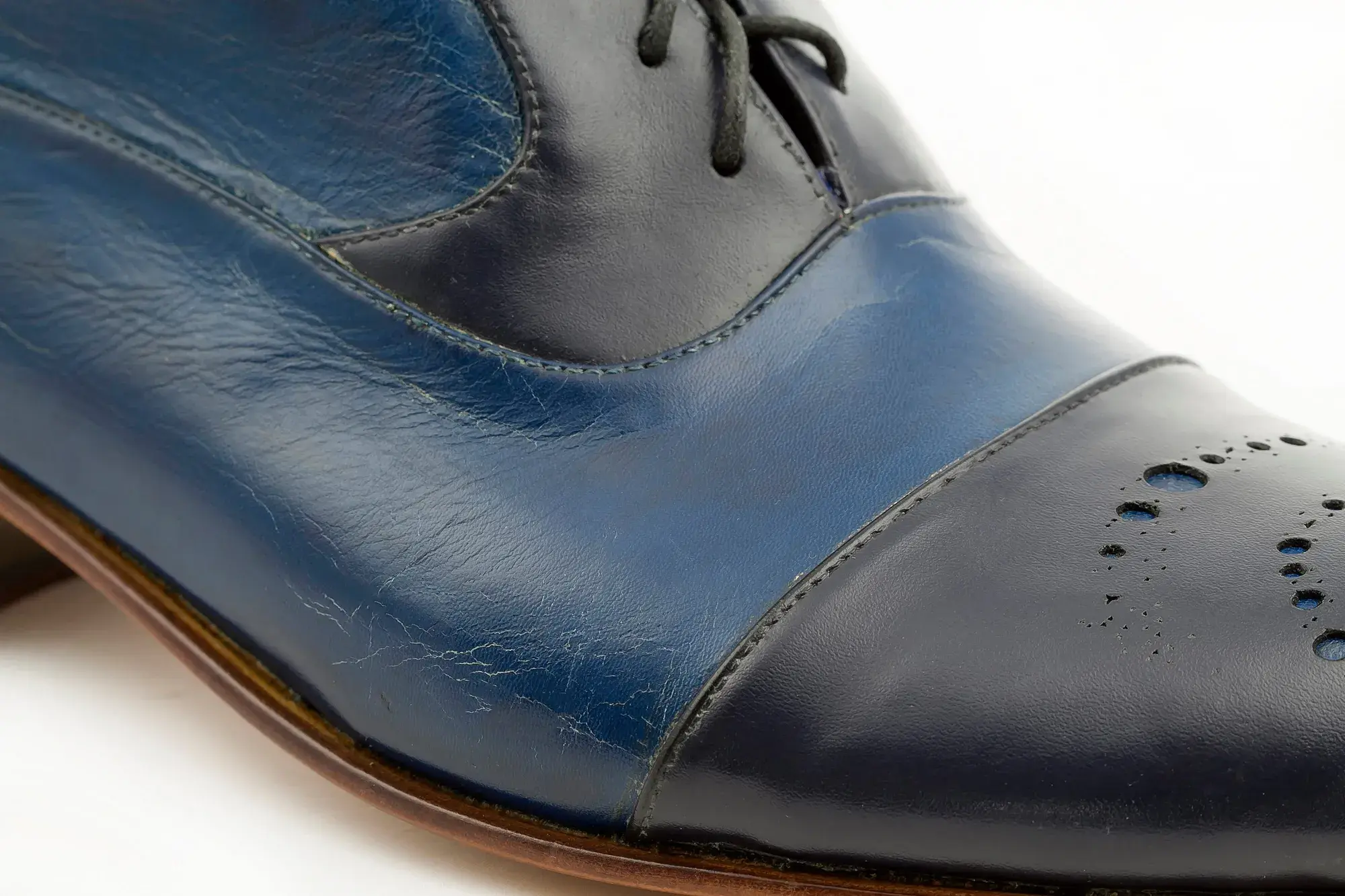 Toe detail of a navy capped boot