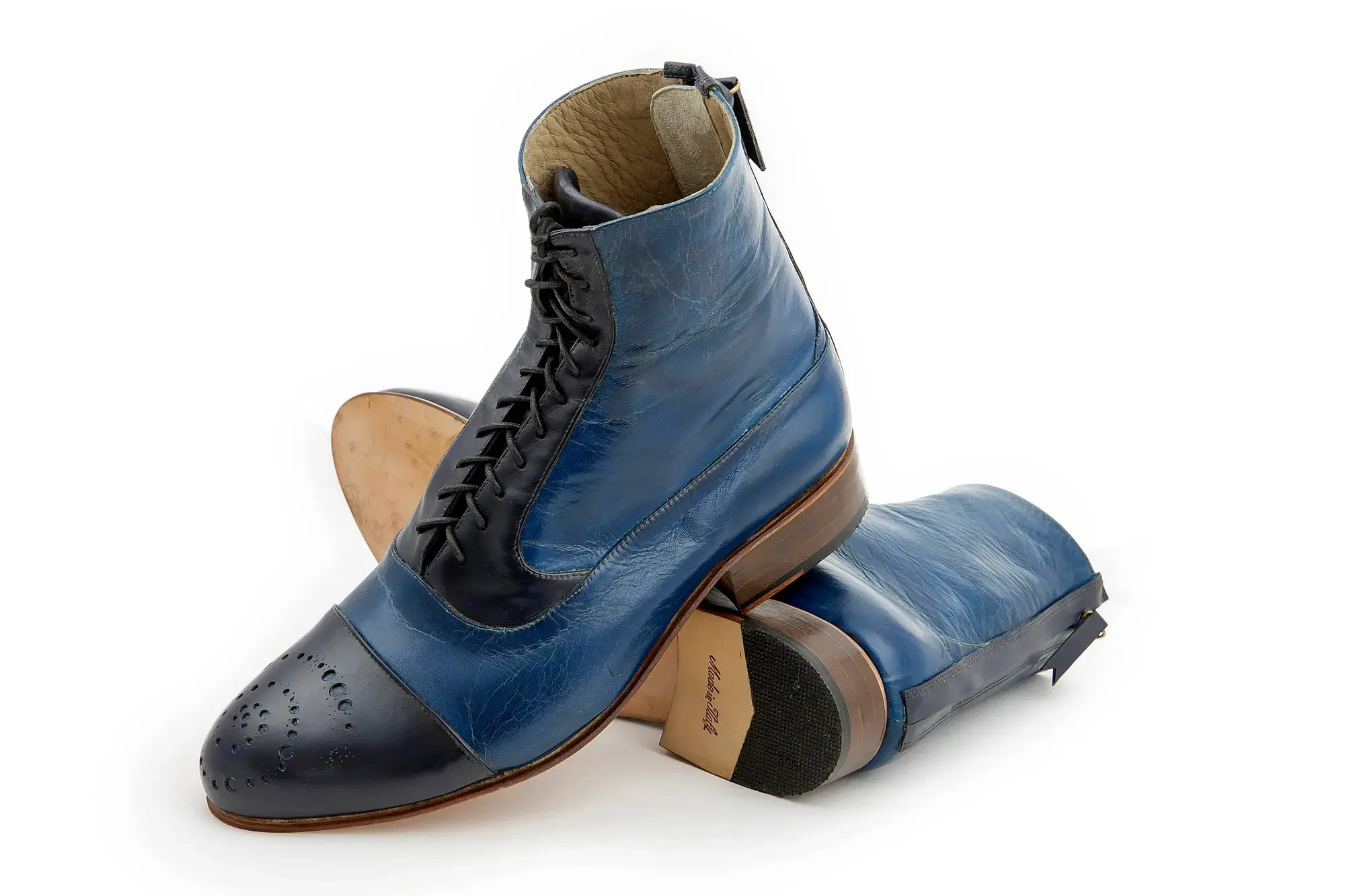 Navy Capped Boots, one resting across the other