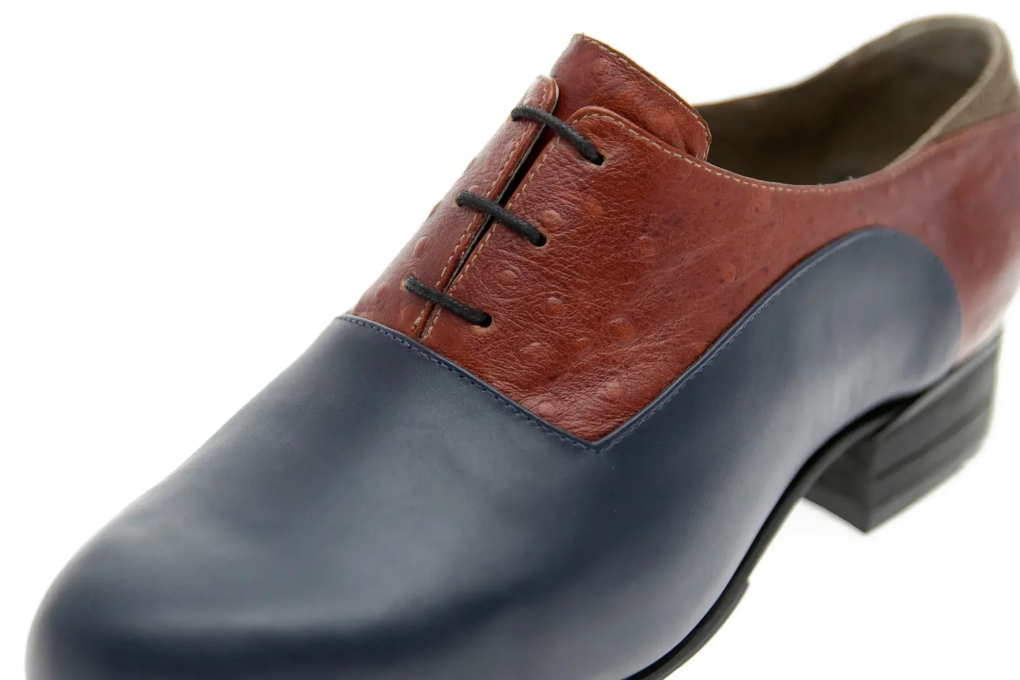 Toe detail of a navy and rust oxford