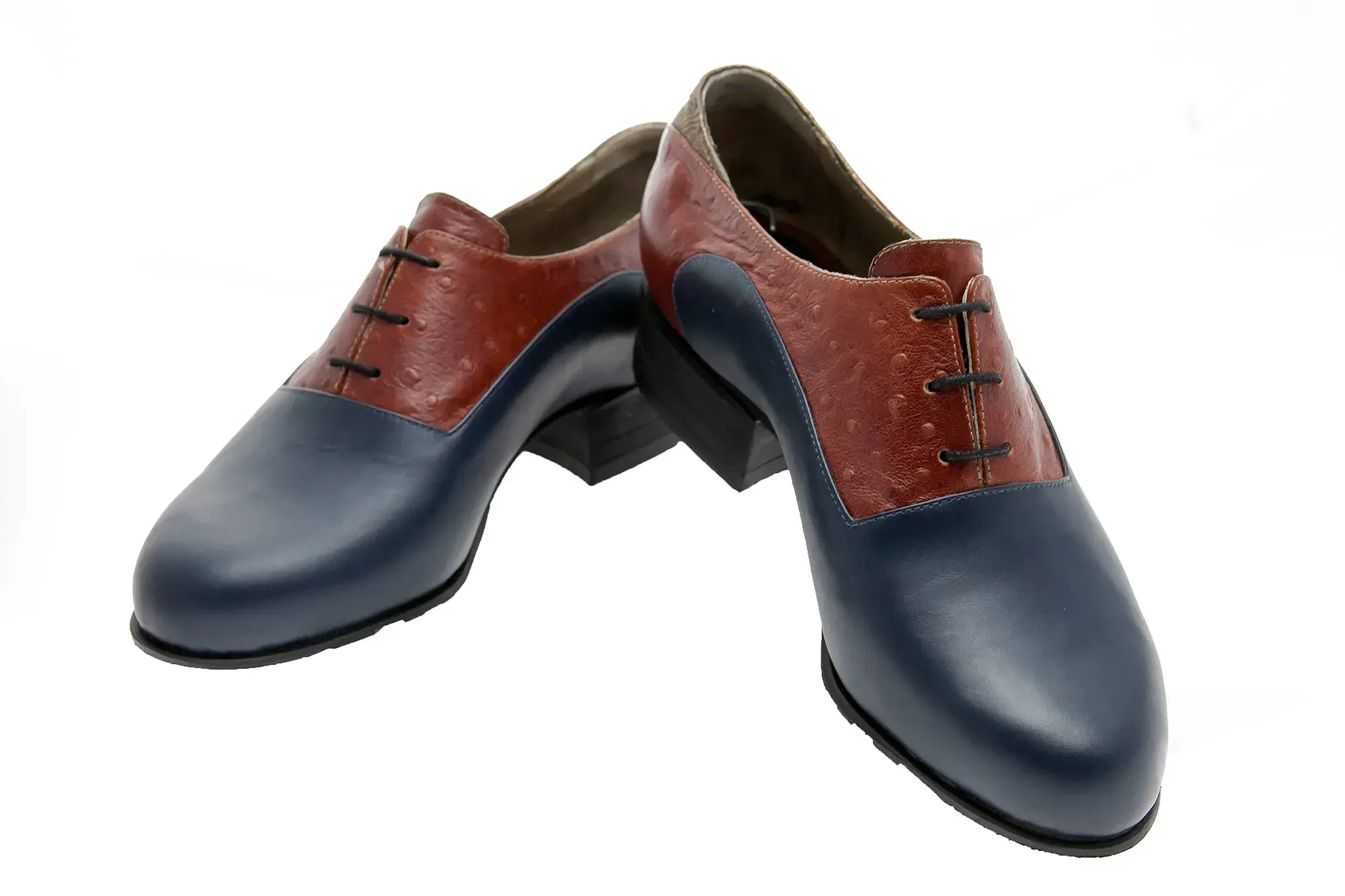 Navy and Rust Oxfords, one resting across the other