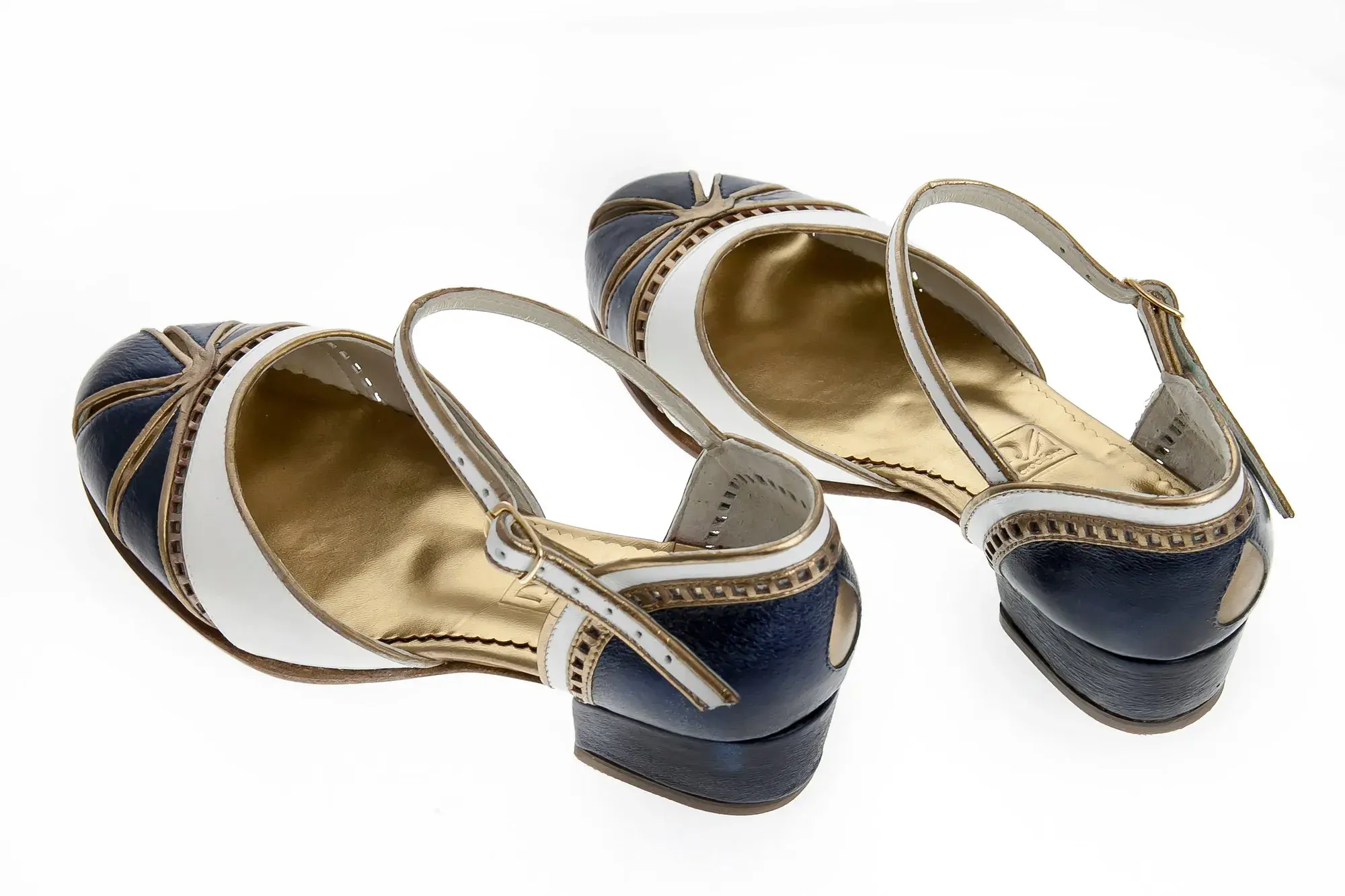 Navy, White and Gold Mary Janes, seen from behind