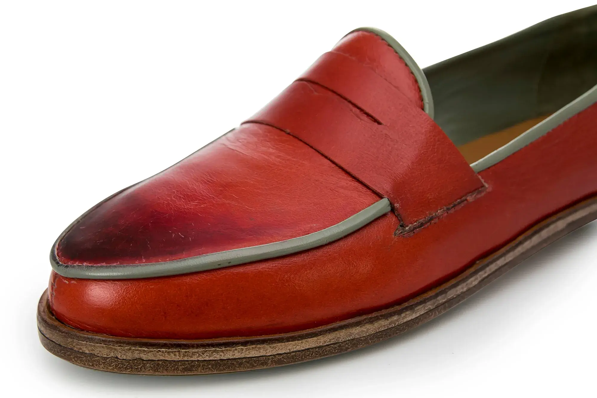 Close-up of a red penny loafer