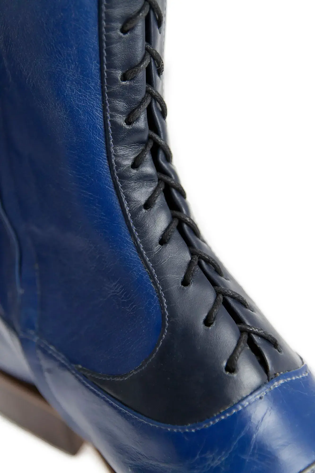 Shaft detail of a royal blue and navy boot