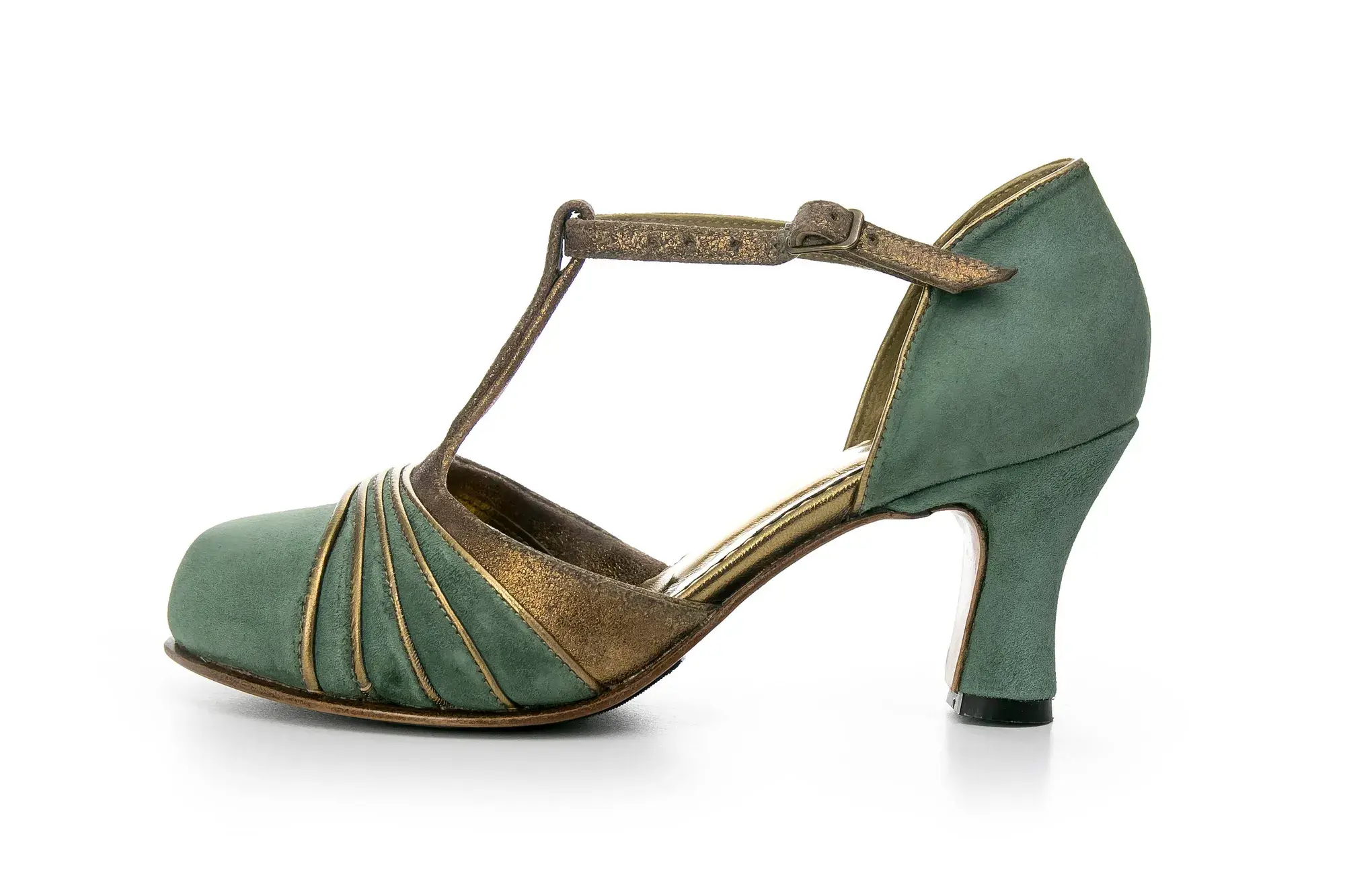 A sage T-bar heel seen from the side
