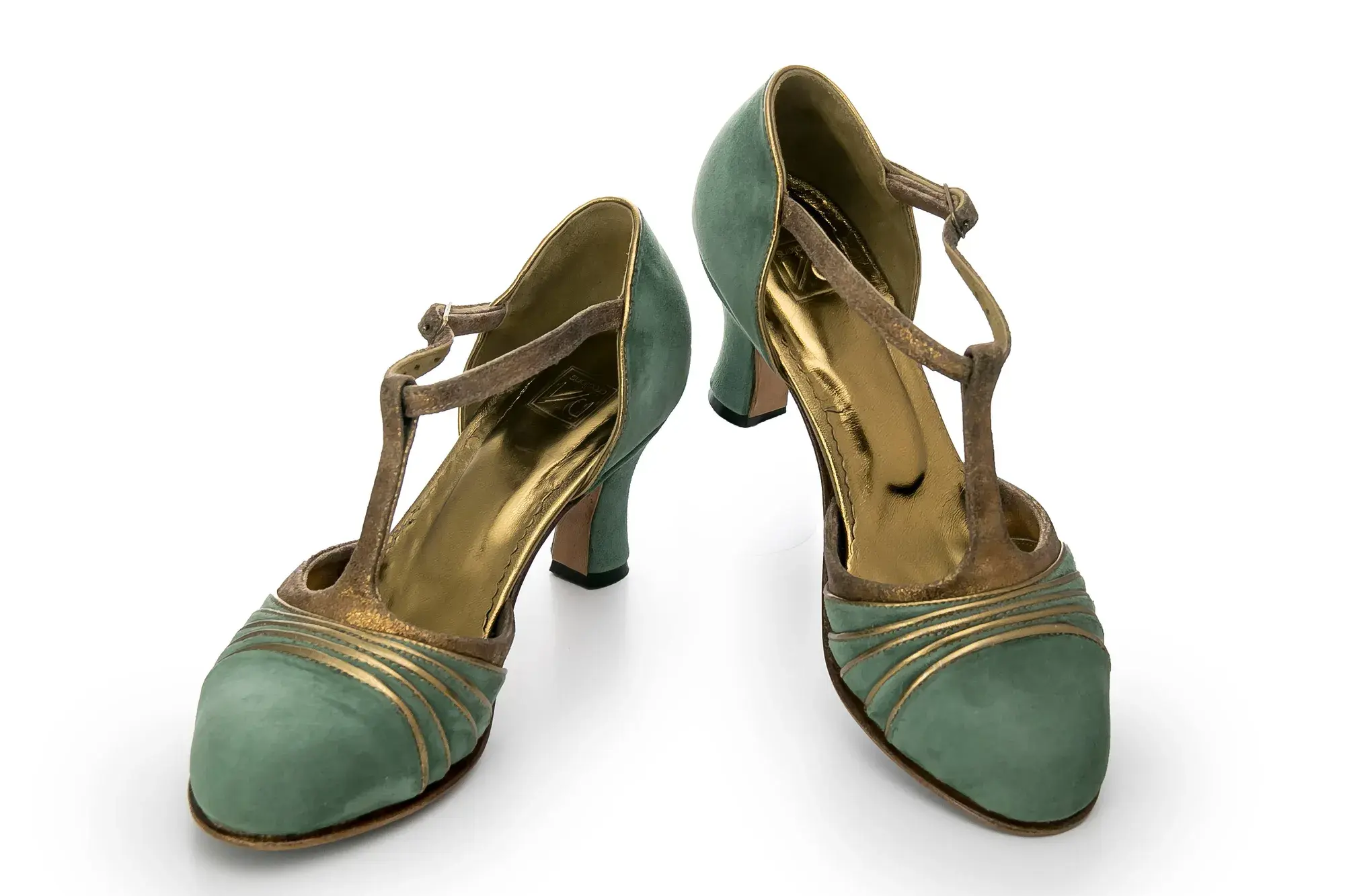 Sage T-bar Heels, one resting across the other