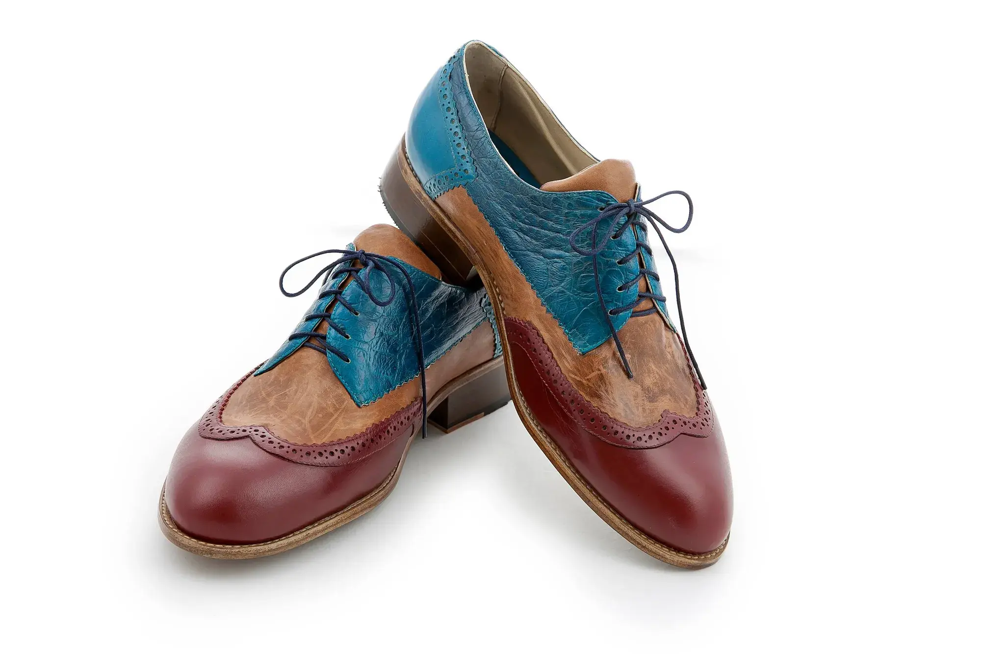 Teal, Tan and Burgundy Brogues, seen from the front at an angle