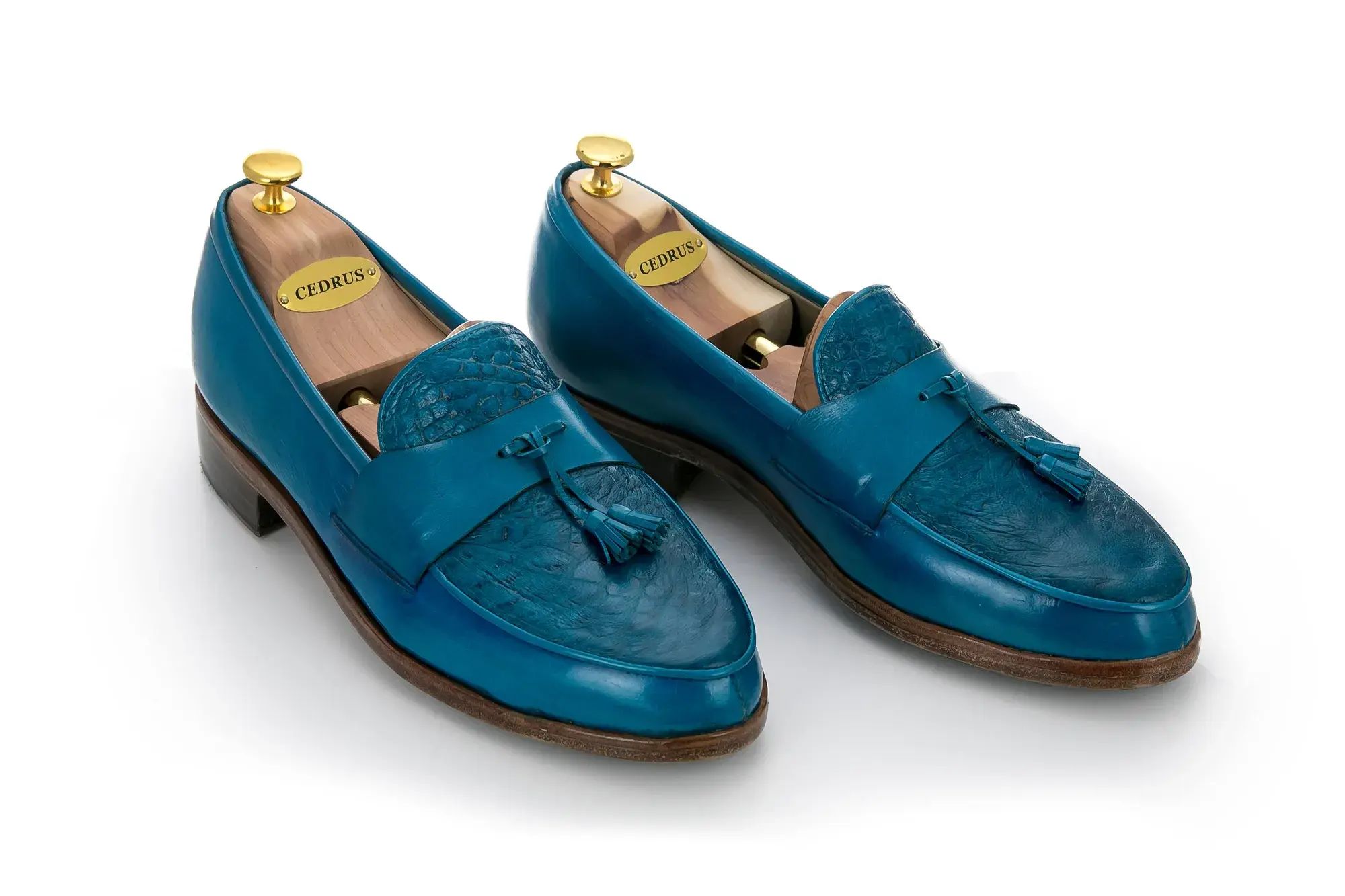 Turquoise Tassel Loafers, seen from the front at an angle
