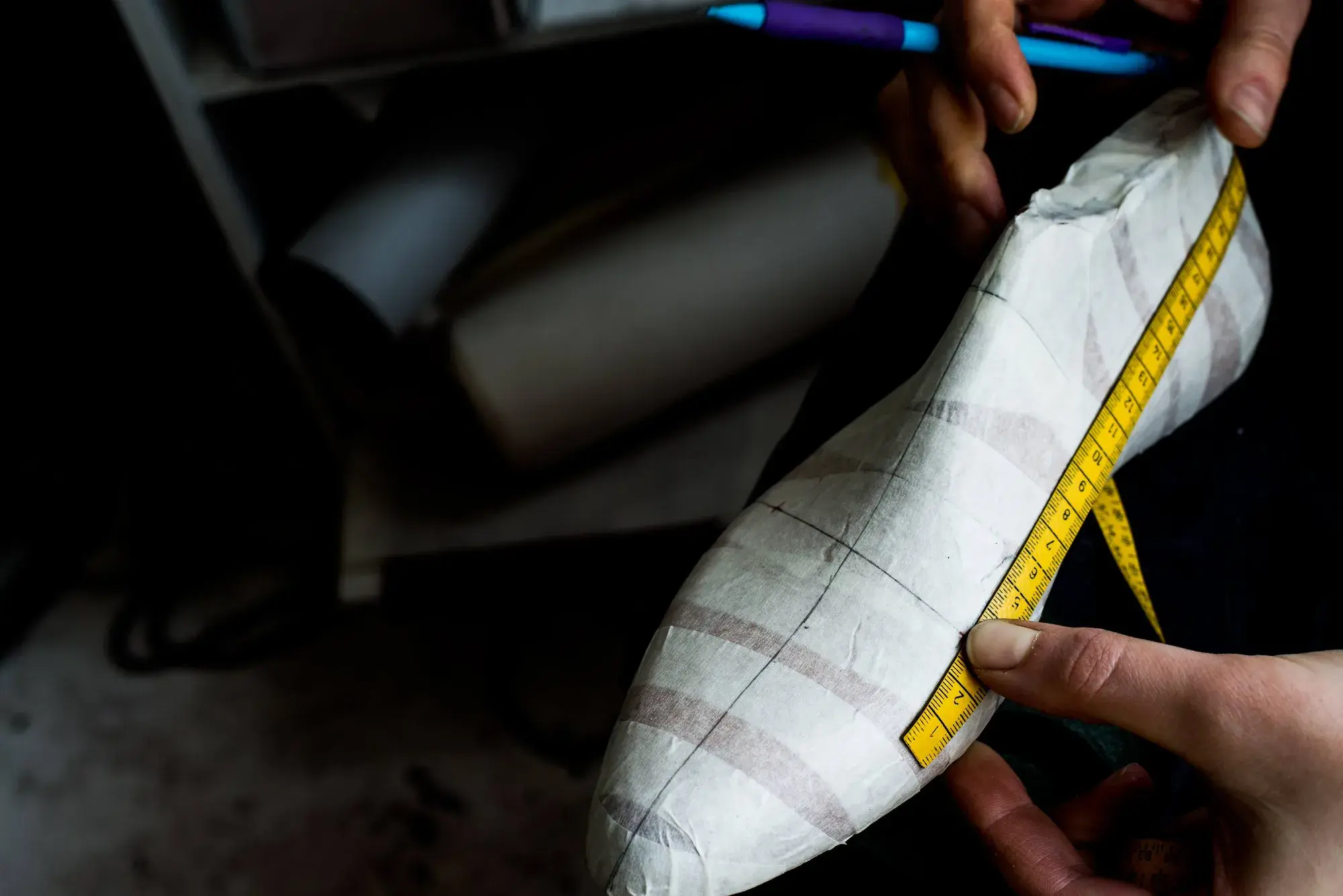 A tape measure laid along the length of the taped last