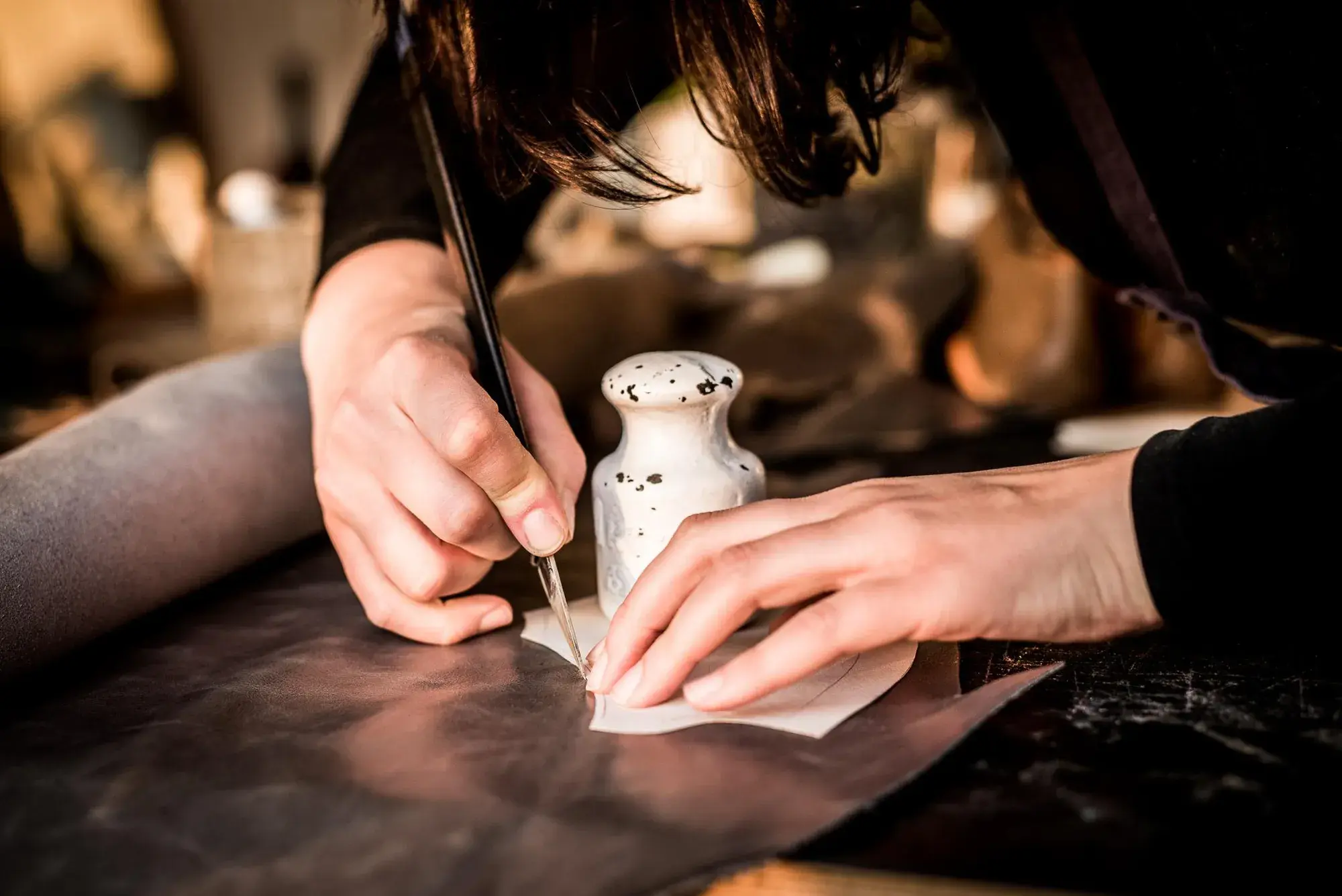 A pen marking around a pattern piece on leather